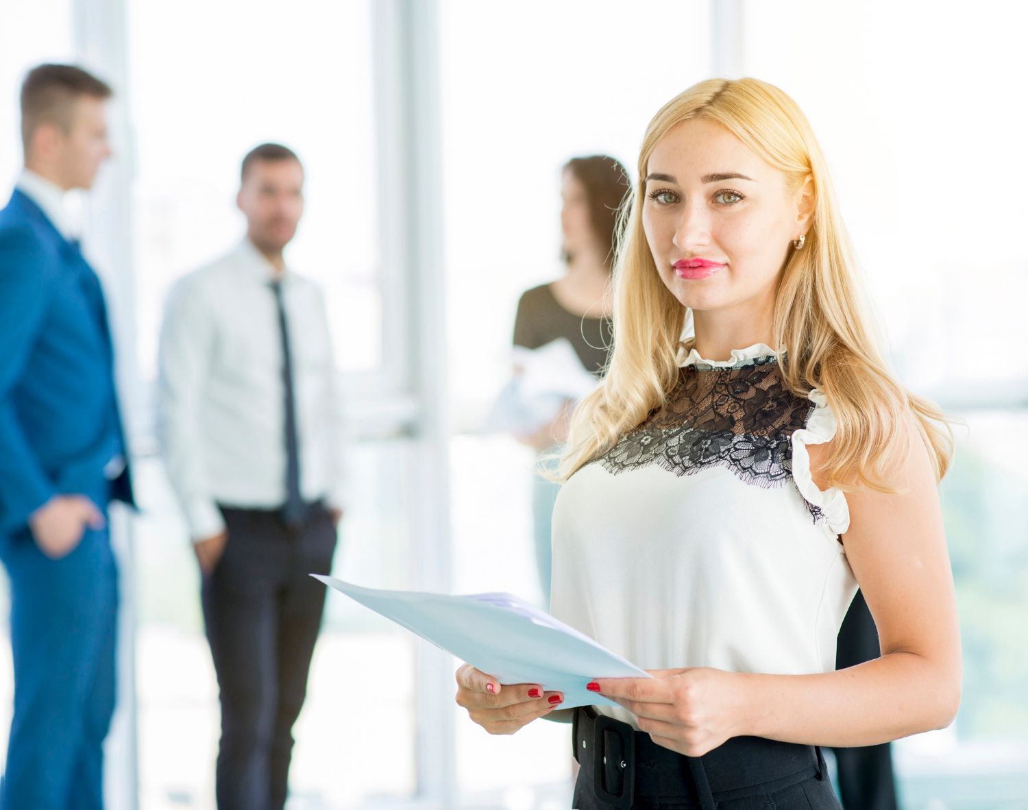 pretty businesswoman holding documents office